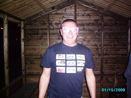 paul in the shed with the glasses on