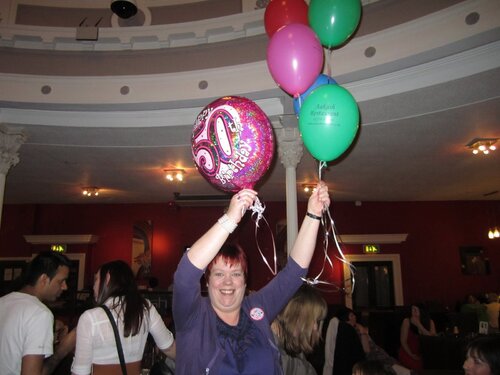 lifted by her balloons