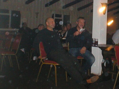 men laffin at silly women dancing